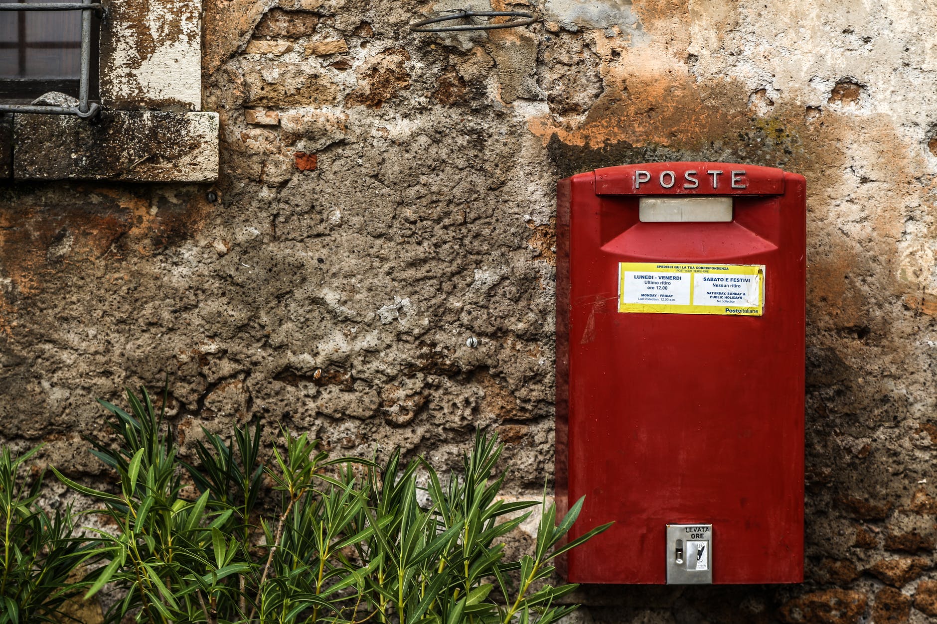 red mailbox in a wall