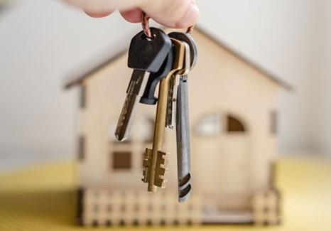 photo of keys in front of a house