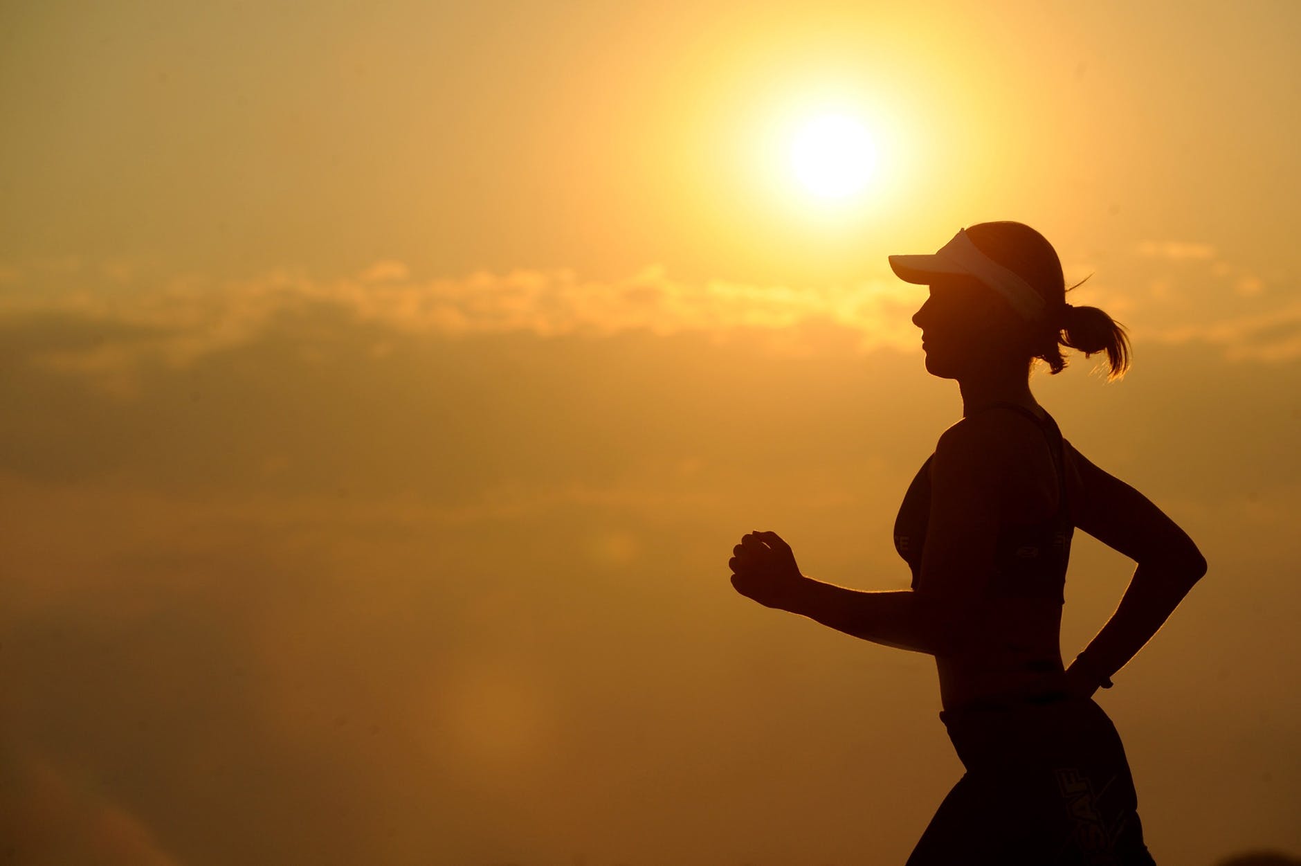 silhouette of a woman jogging